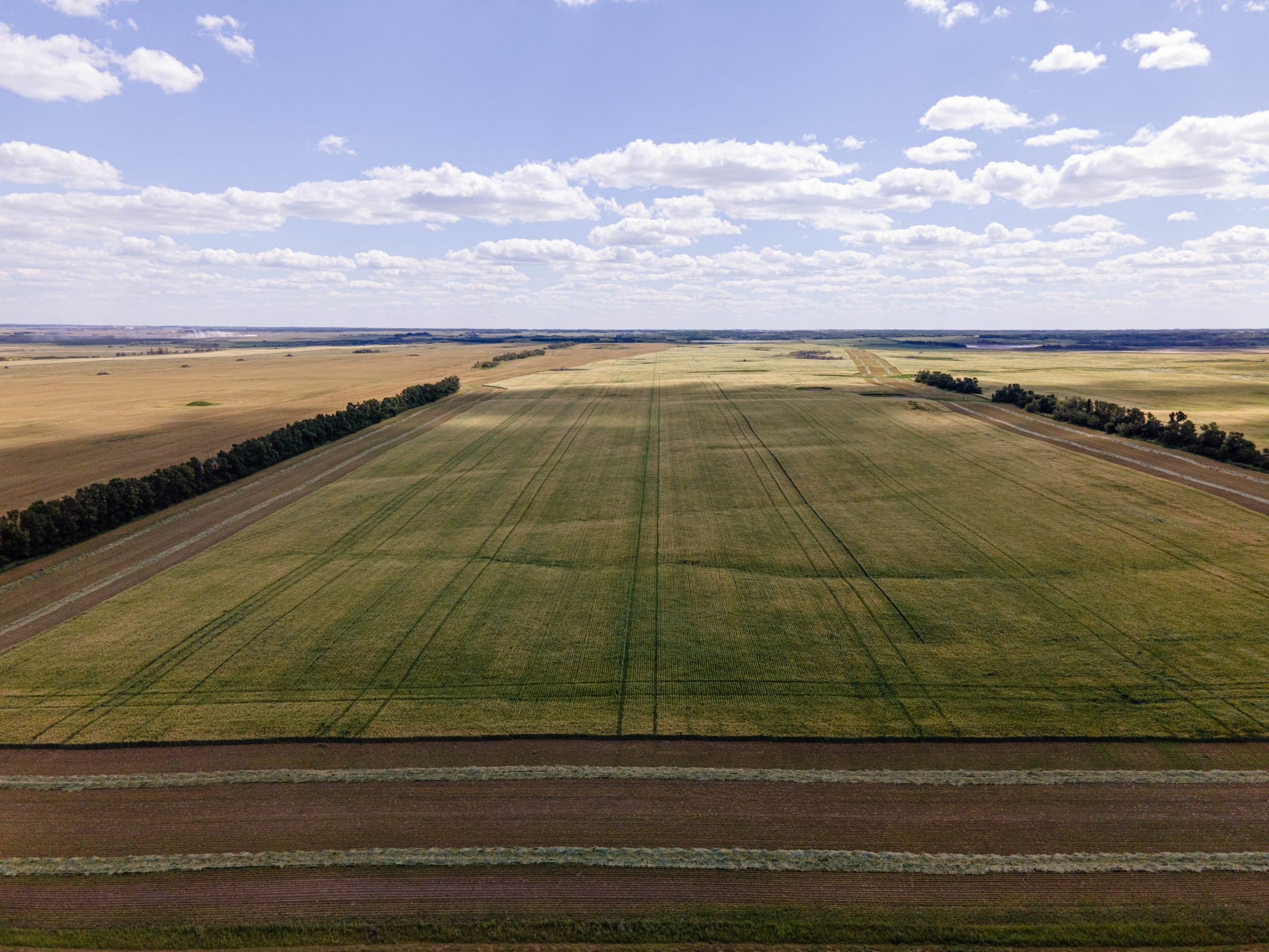 Wide Saskatchewan prairie sky over Lazy T Ranch land near Indian Head
