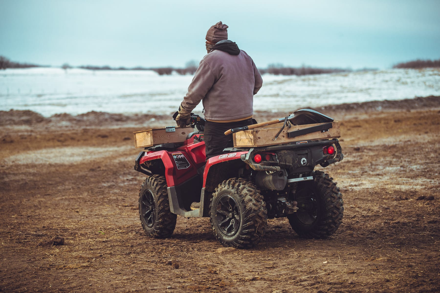 Lazy T Ranch crew member on an ATV checking cattle through a Saskatchewan winter